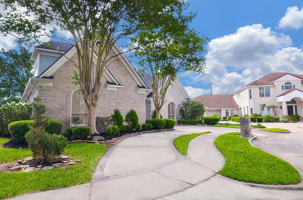 Great Curb Appeal with a 2 Car Attached Garage and Circular Driveway.