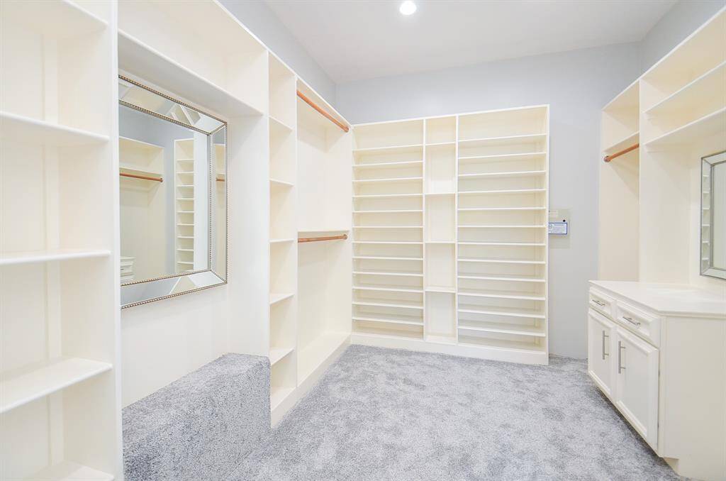 Closet with Plenty of Storage, Built-in Cabinetry and Shelving to Organize Your Shoes.