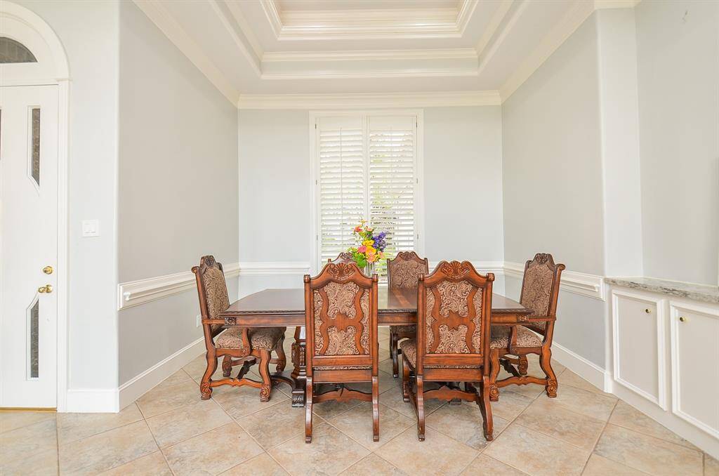 Host Magnificent Dinner Parties in the Elegant Formal Dining Room, with Features including Doubled Coffered Ceiling and Crown Molding.
