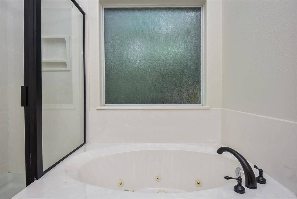 The big frosted window allows privacy and natural light any time of day (or night), as you float your cares away in this darling jetted tub.
