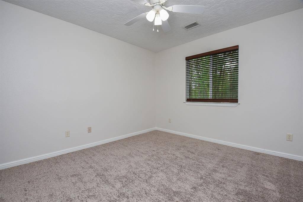 A higher placed window in this secondary bedroom leaves more space for your treasures!