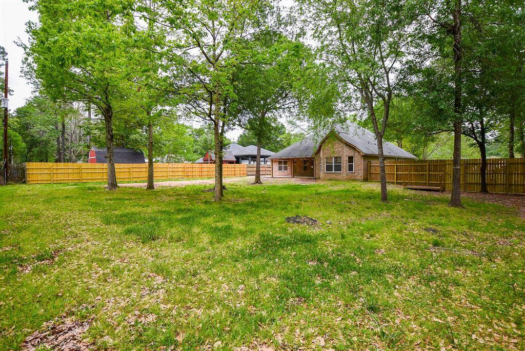 Your entire backyard is fenced in for privacy and comfort. (Lush resident trees are, again, courtesy of Mother N.)