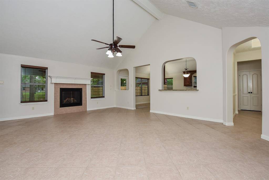 The open floor plan design concept is appreciated here, with tremendous blended common space. Up right are the kitchen and dining areas.