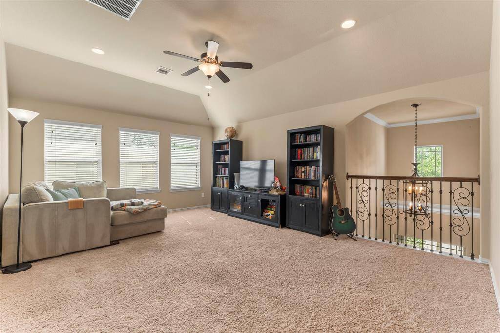 This versatile game room offers endless possibilities—whether you're envisioning a playroom, party space, or gaming hub. With plenty of room for gaming tables, toys, or entertaining, it’s ready to adapt to your lifestyle. A nearby hallway bath adds extra convenience for guests.