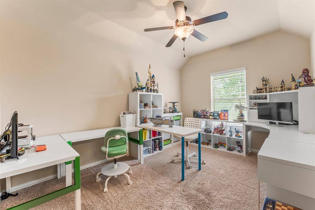 Three secondary bedrooms and two full baths are located on the second floor. This room features lush carpeting, gambrel ceiling, large walk-in closet, sunny window with blinds, and lighted ceiling fan. It shares a Jack-and-Jill bath with Bedroom 4.