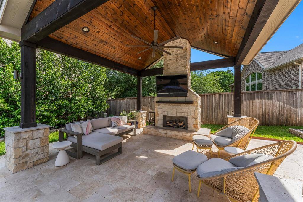 Wow your guests with this beautiful gazebo, featuring a vaulted wood ceiling and striking stone-and-wood pillars. Spacious enough for a large dining table or a cozy outdoor living area, it’s perfect for entertaining in style. The centerpiece—a dramatic two-story stone fireplace—sets the tone for unforgettable gatherings. Add your outdoor TV, and you’ve got the ultimate spot to catch the big game or enjoy a relaxing evening with friends.