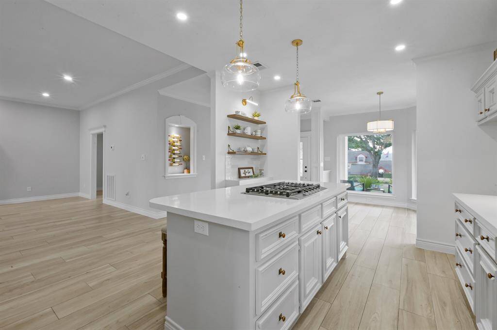 The kitchen features a New KitchenAid oven and microwave combo along with a new dishwasher.