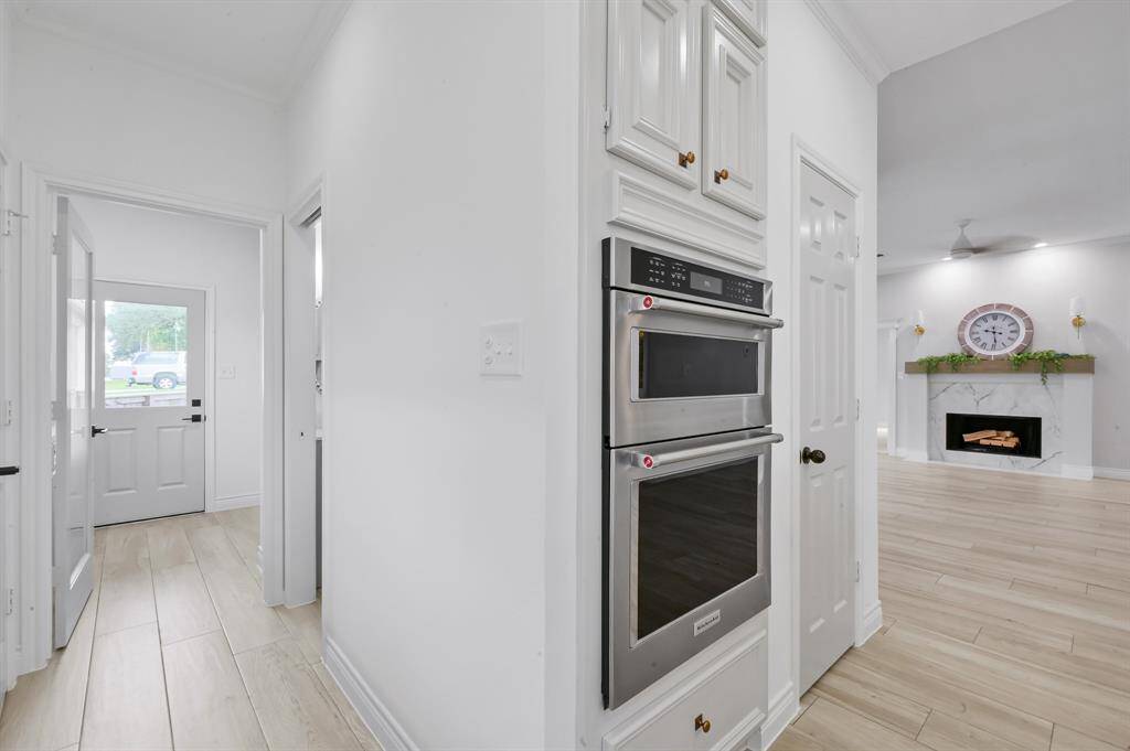 Lovely farmhouse sink and grand bay window provide large workspace, expansive views, as well as a nice spot for your indoor plants.