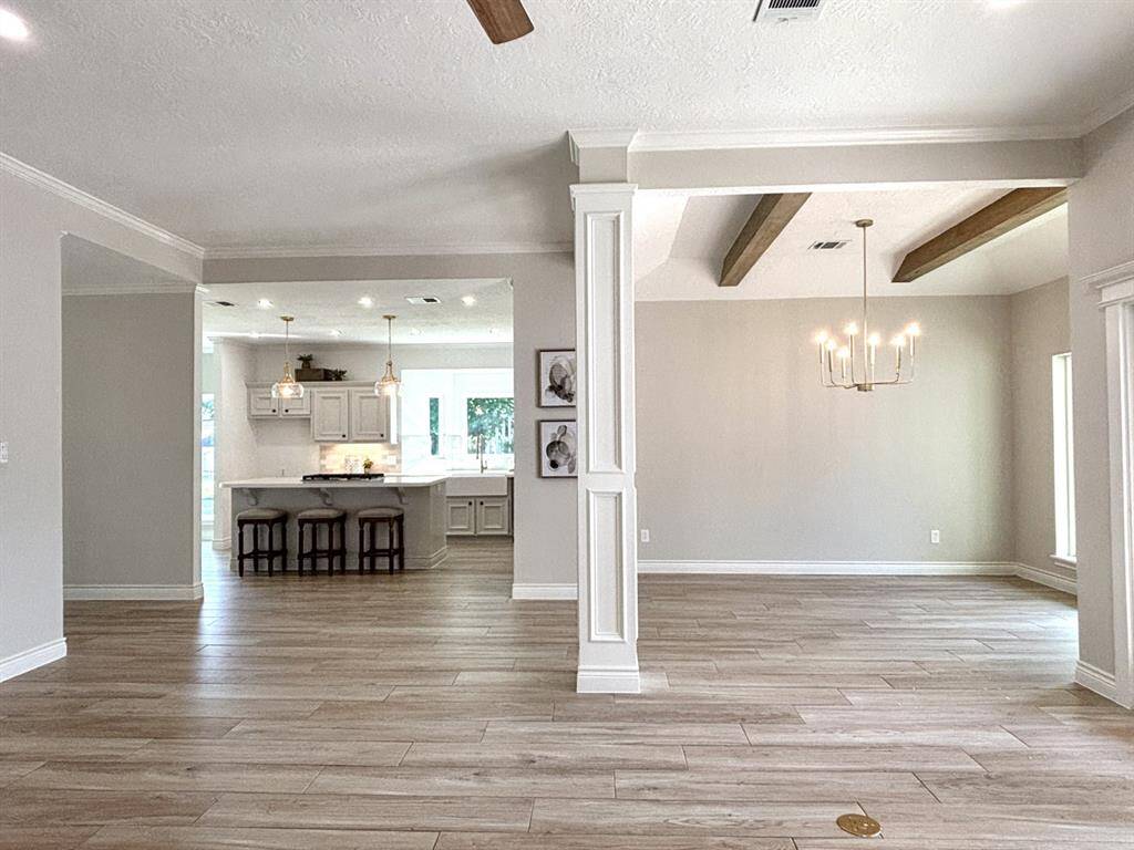 Modern, simple and elegant fireplace surround.  There is a plug on the wall behind the clock for your TV.