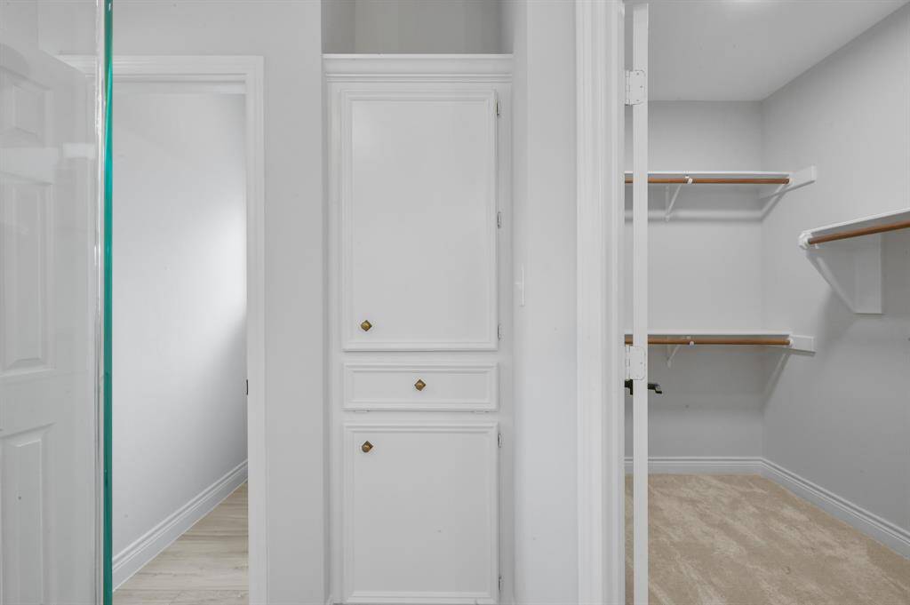 The secondary bedroom features lake views and is located at the front of the home.