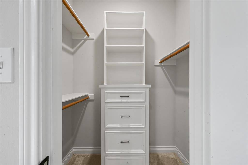 An alternate view of the second bedroom is provided. This room can also be used as an office.