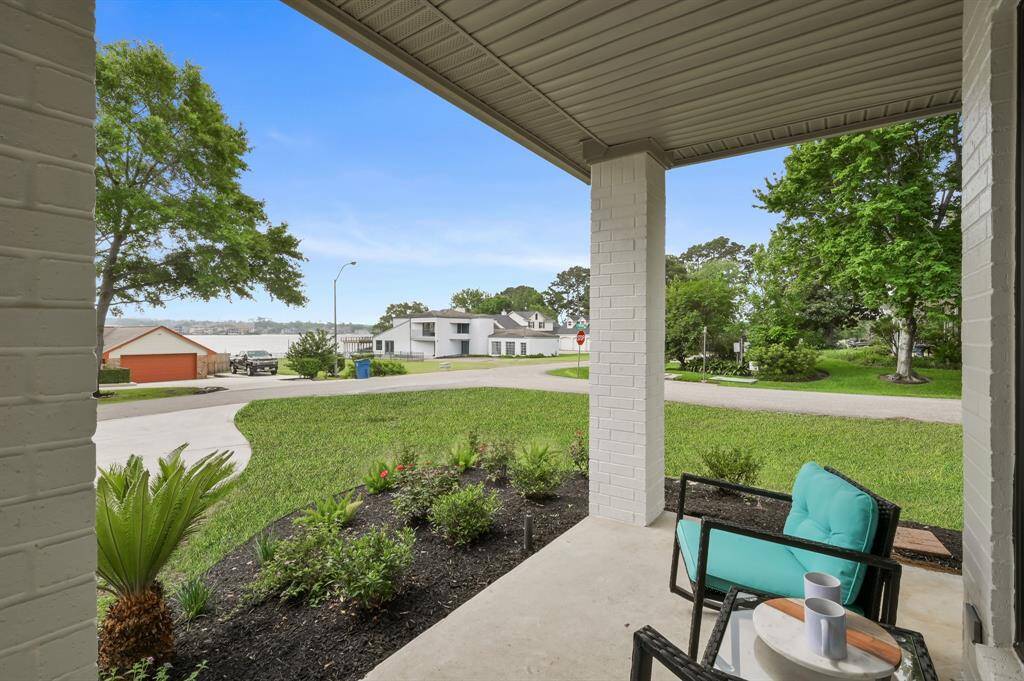 Take time to relax and unwind, while you enjoy the fresh air, and take in the lake views from the front porch. Note- waterview is closer than it appears in the image.