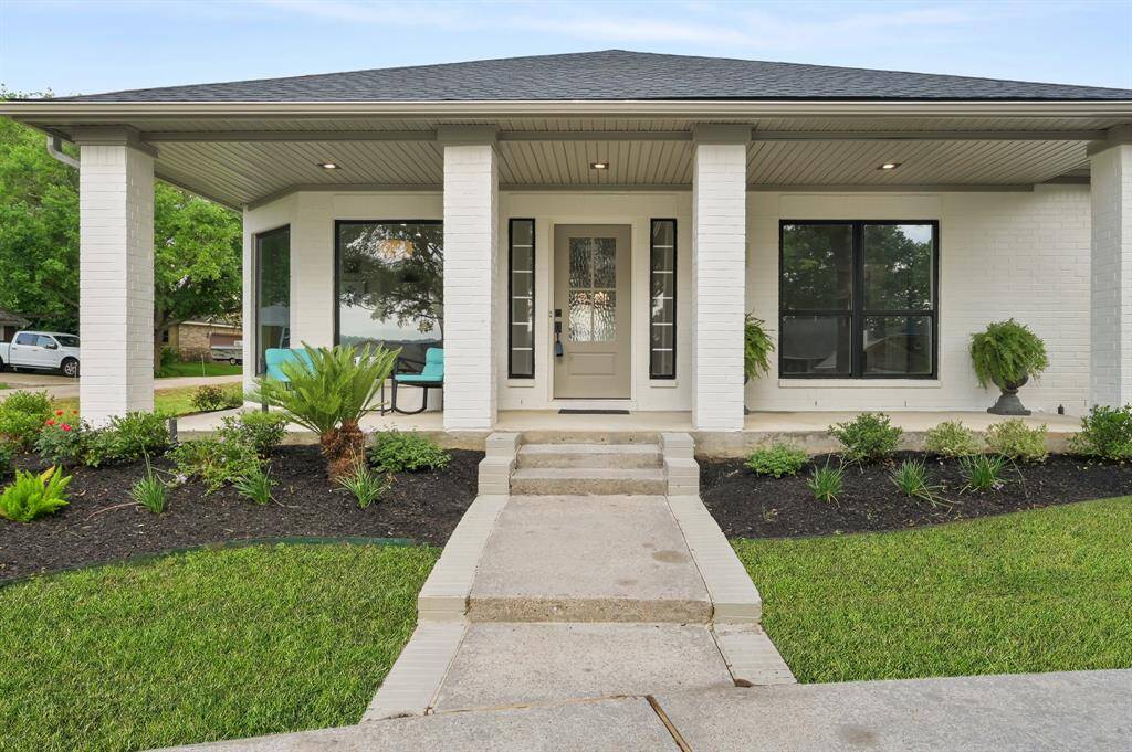 The porch, spanning the front of the home, is an inviting area to enjoy your unobstructed beautiful views of the lake.