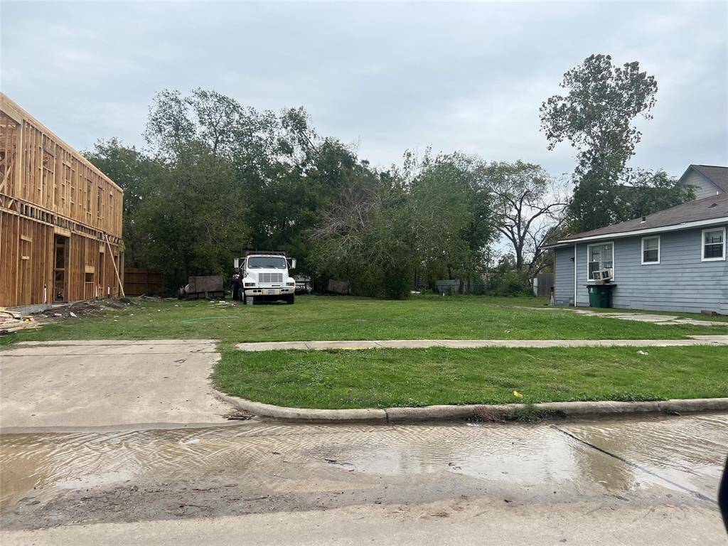Lot view with new townhome near the property.