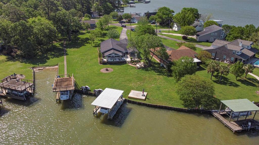 Boat house with light colored roof goes with property