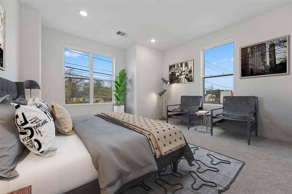 Primary bedroom photo is virtually stage