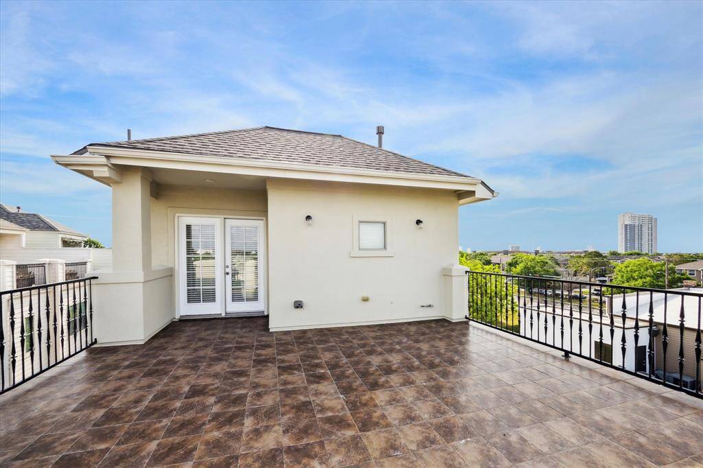 Step through the exit door to your expansive rooftop retreat—perfect for grilling, lounging, and soaking in the incredible breeze. Recently painted ironwork railings add beauty and charm, framing this open-air space designed for stylish outdoor living
