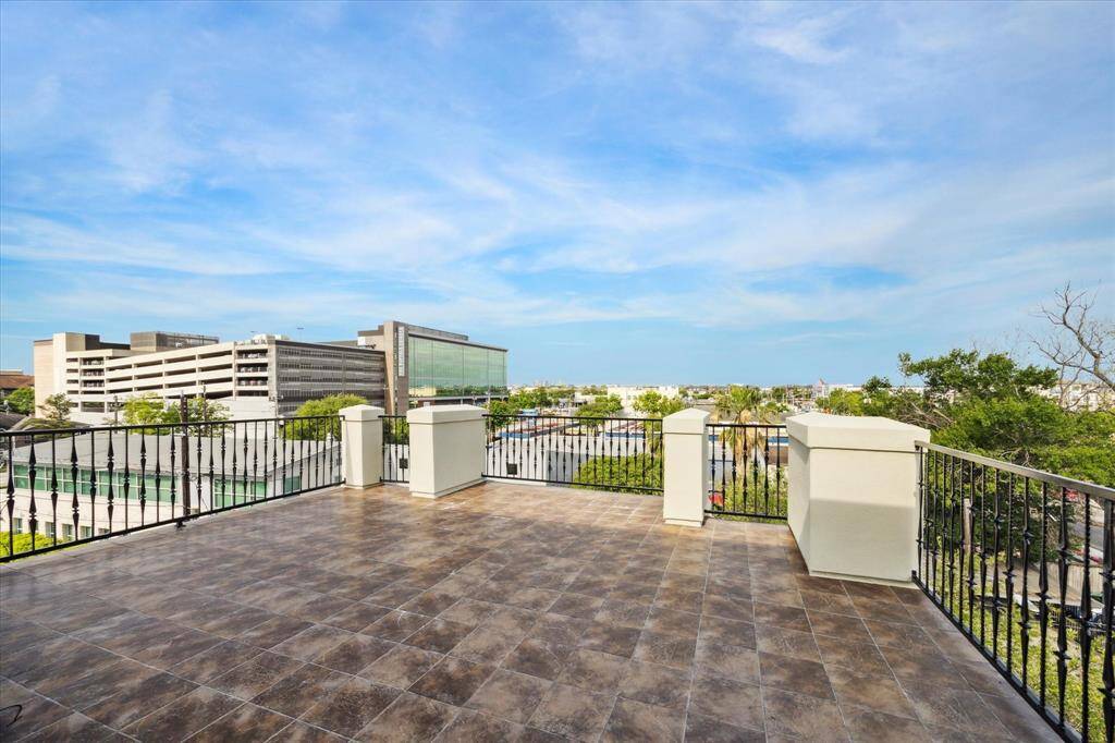 Expansive fourth-floor rooftop terrace offers ample space for grilling, lounging, and entertaining—your own private escape with room to relax under the stars or host unforgettable gatherings with the city skyline as your backdrop.