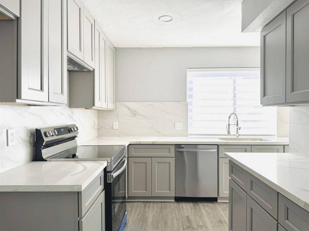 Step into this beautiful, modern kitchen featuring sleek, contemporary cabinetry, stylish countertops, and stainless steel appliances. Perfect for cooking meals and entertaining guests in style!