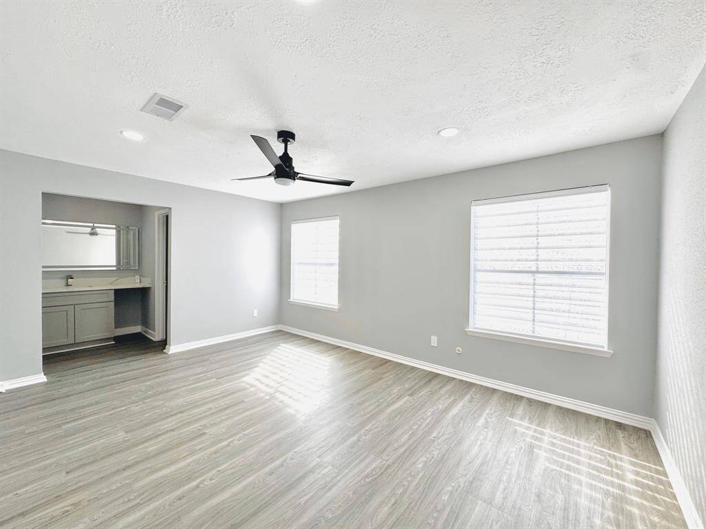 Primary Suite: Retreat to your large master suite, featuring a spacious layout, soft natural light, and a tranquil ambiance perfect for unwinding after a long day.