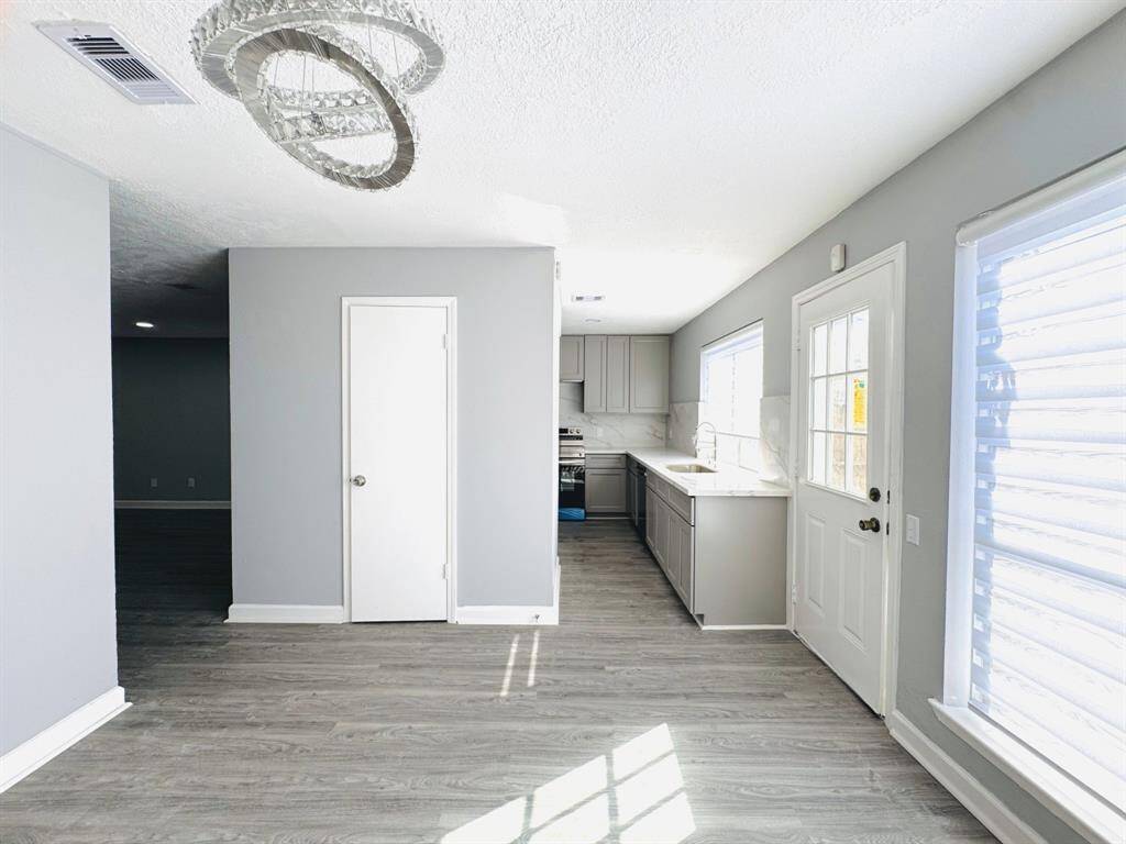 Wide hallways and smooth, beautiful flooring lead you to the various rooms in this home, adding an extra touch of elegance and ease of movement throughout the space.