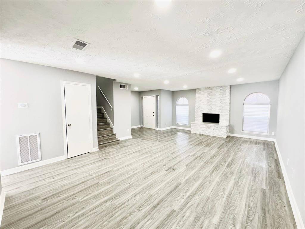 With its open layout and abundant natural light, this living room offers the perfect space for both entertaining and relaxing in comfort.