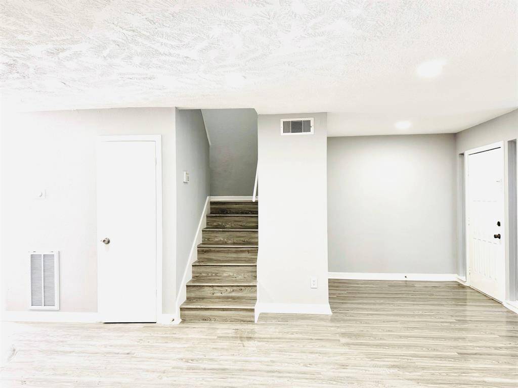 Wide, welcoming stairs lead you to the second floor, making your transition between levels effortless and stylish.