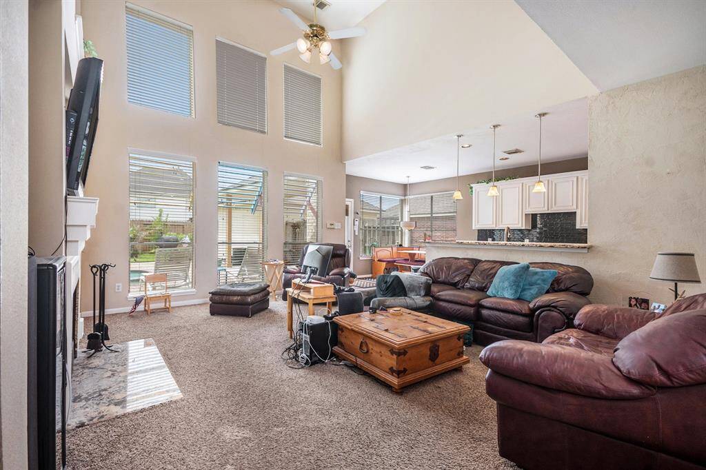 Two story family/living room. Lots of windows for natural lighting.