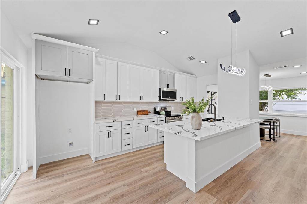 New cabinetry and modern finishes in the kitchen. Everything in this home has been upgraded.