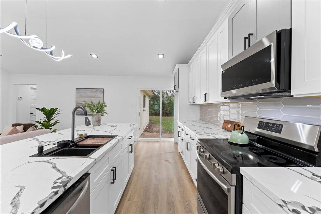 Stainless steel appliances in the kitchen.