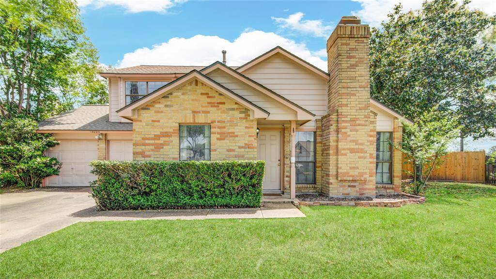 This well-maintained two-story home makes a strong first impression with its crisp brick exterior, mature trees, and neatly edged landscaping.