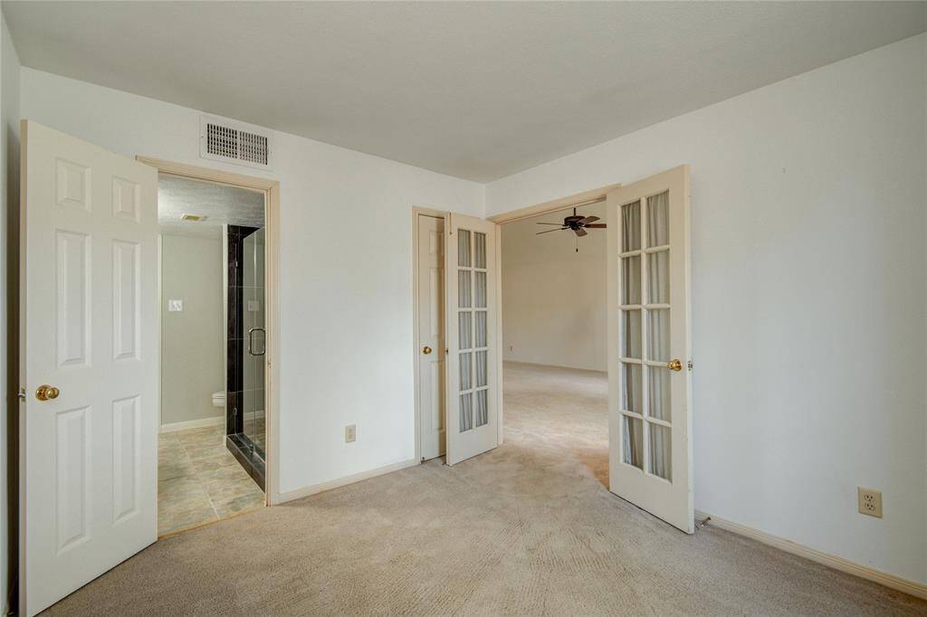 This flexible space features French doors and ensuite access, offering comfort and convenience for any use.
