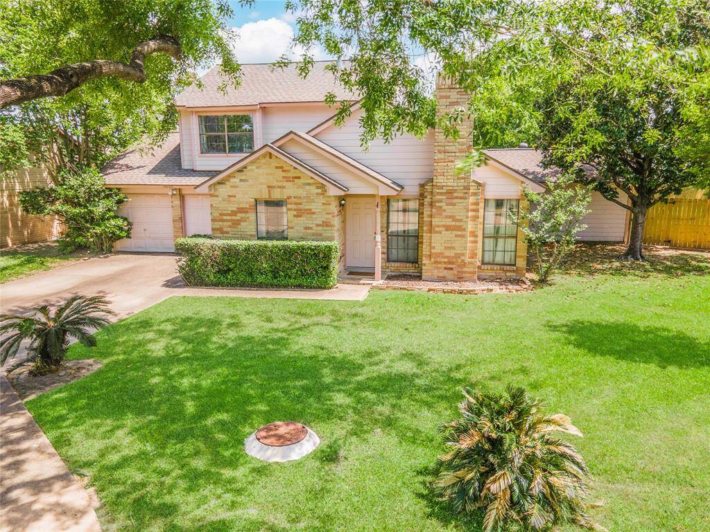 This charming brick home sits on a quiet cul-de-sac just steps from the community pool, framed by sago palms, mature trees, and a peek at the new side fencing.