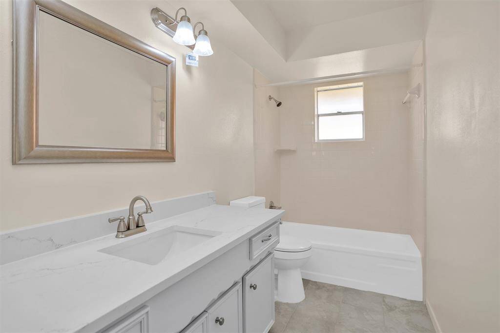 Bathroom #2 features Quartz counter-tops and a tub/shower combination.