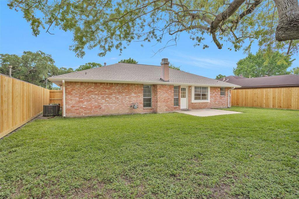 Step outside into your spacious, low-maintenance Backyard! Take a look at the back of this 4-sided brick house!