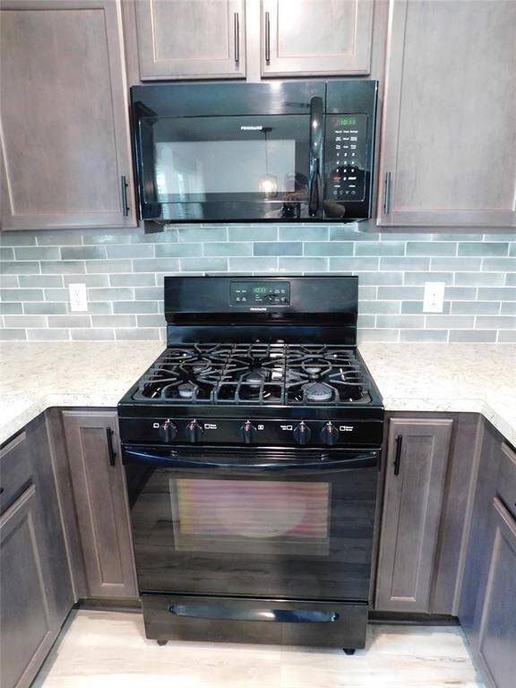 Five burner stove with built-in microwave