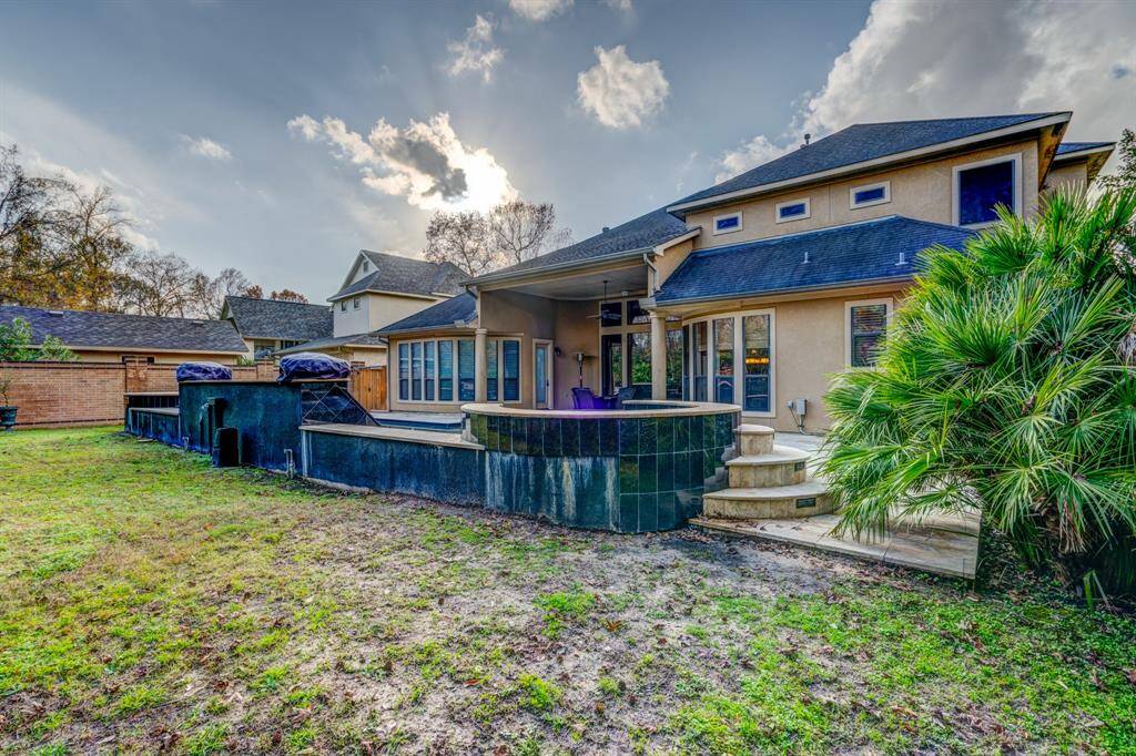 Backing up to a nature reserve, the home offers highly coveted privacy and unwavering natural beauty. Watch the flames flicker from the wood burning outdoor fireplace and savor the quiet solitude.