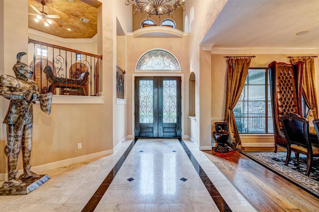 Magnificently designed, the entrance is towering and reflects old world charm from homes of the Mediterranean coastlines.