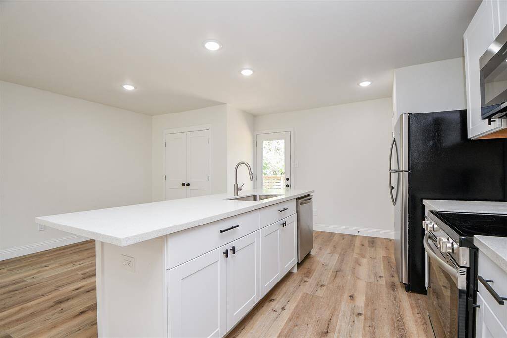 Stainless steel refrigerator is being offered to stay.