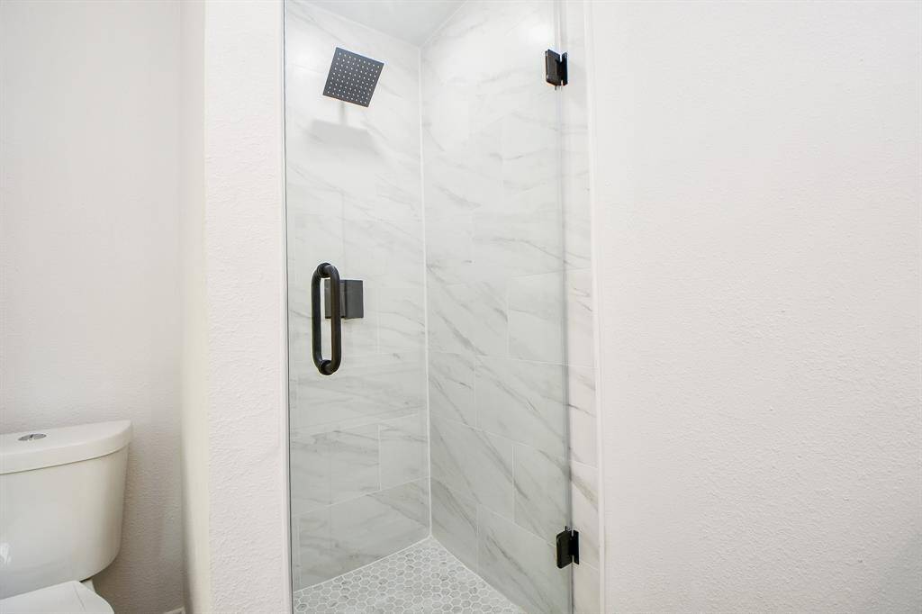 Primary glass-enclosed shower.