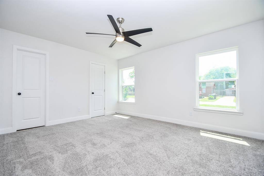 Primary Bedroom: Door on the left is a walk in closet.  Door on the right is a private en suite.