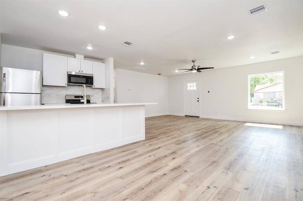 Large open-concept family room-kitchen.