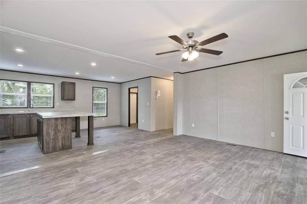 Spacious Livingroom with Open Floor Plan to Kitchen and Dining