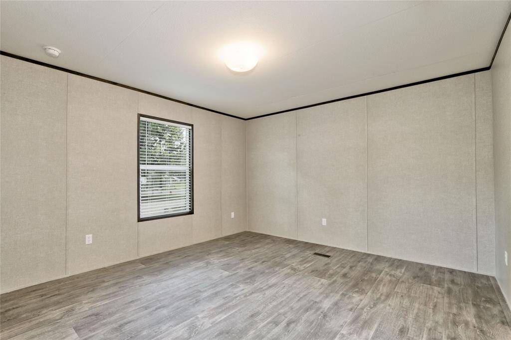 Primary Bedroom overlooking frontyard with en-suite bathroom