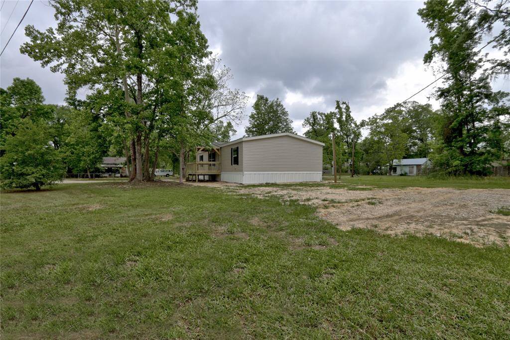 View from corner of yard with extra space to park