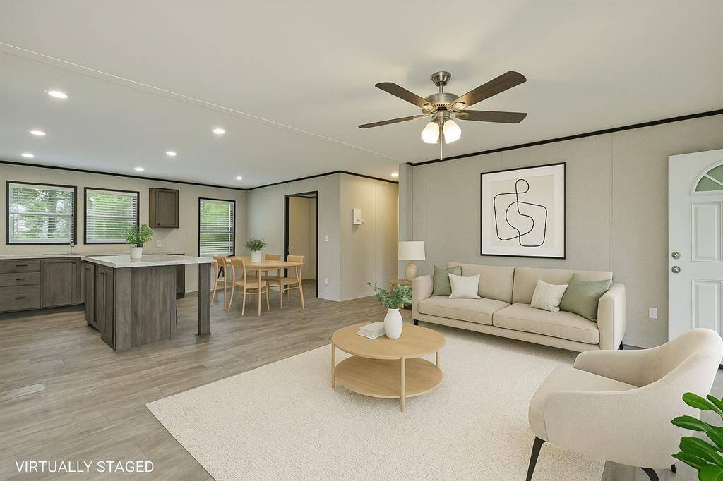 Spacious Livingroom with Open Floor Plan to Kitchen and Dining