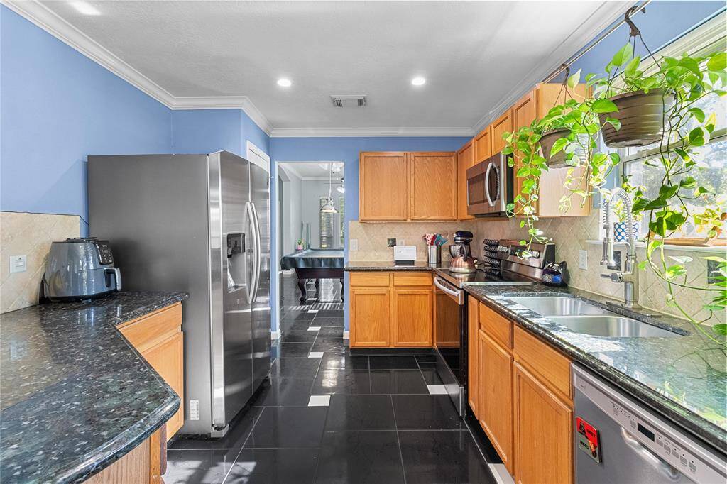 large open kitchen with a window