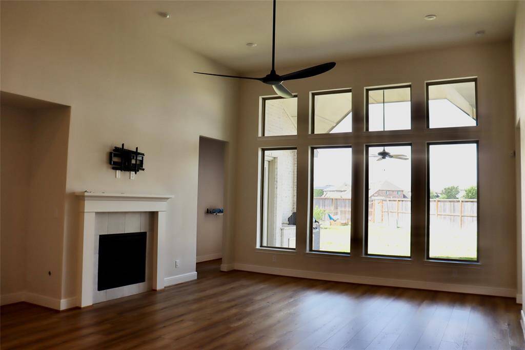 View of the family room with plenty of natural light and a fireplace
