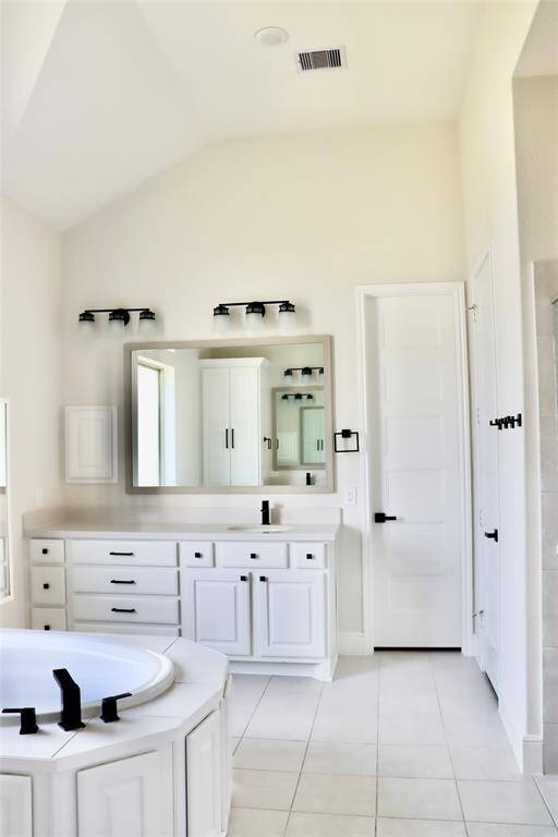 Primary bathroom showing the larger sink of the 2 that it has