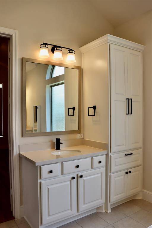 1 of 2 sinks in the primary bathroom with plenty of storage space
